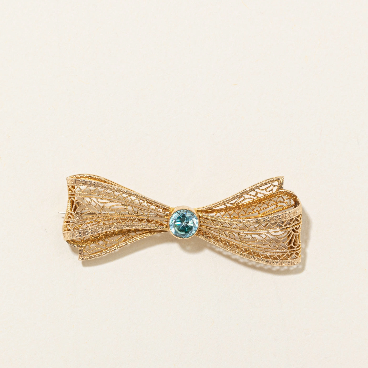 Glam Appeal Cool Layer Bezel Set Blue Zircon Filigree Bow Brooch | 1.10ct