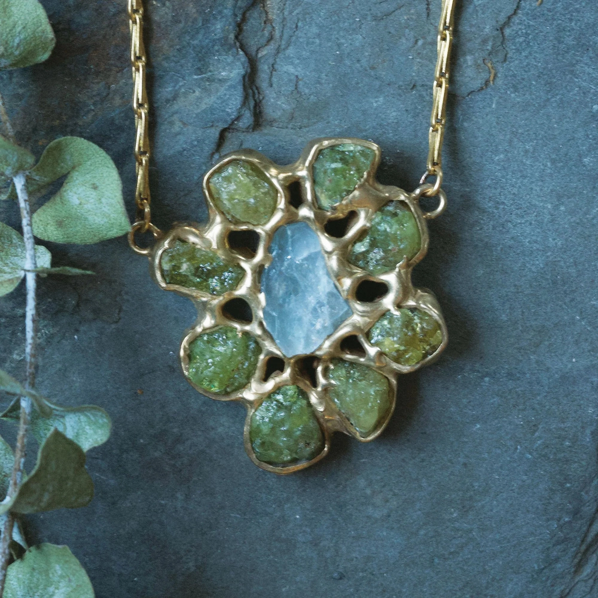 Distinctive Detailing Perennial Pendant - Brass, Green Garnet   Aquamarine